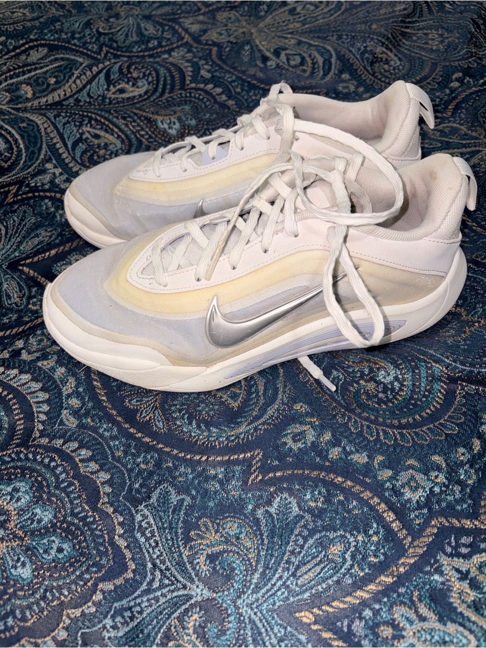 Nike White Sneakers with Pale Yellow Accents and Silver Swoosh